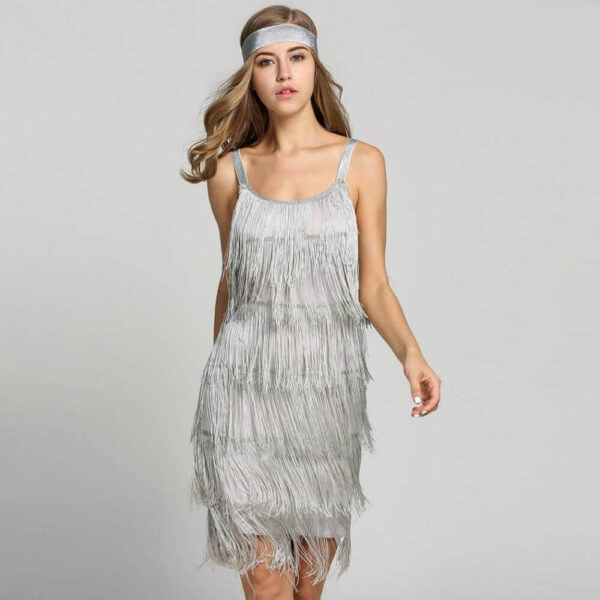 A woman is wearing a Flapper Mini Dress with Headband.