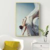 Artistic picture of a woman in a flowing dress, suspended in Grace and motion, hung on a wall.