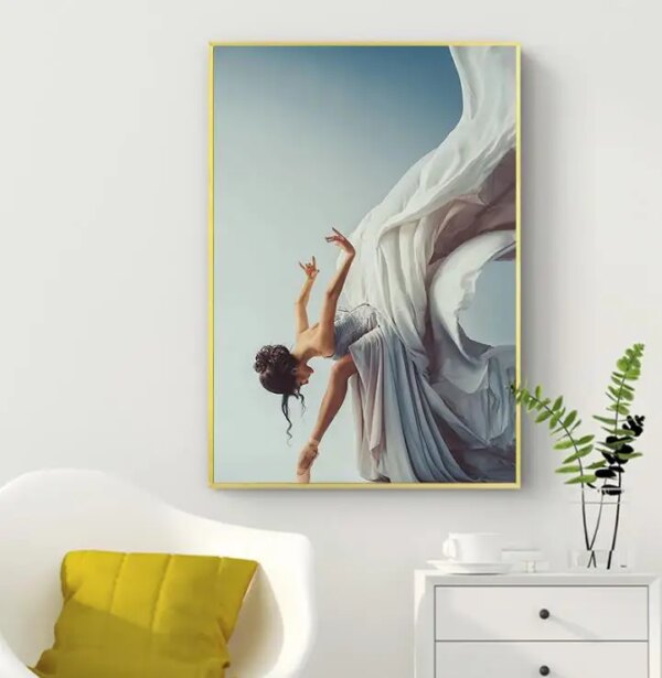 Artistic picture of a woman in a flowing dress, suspended in Grace and motion, hung on a wall.