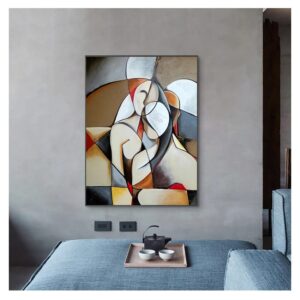 Abstract modern painting hung on a plain wall above a grey sofa with a UNITED IN LOVE tea set on a wooden tray.