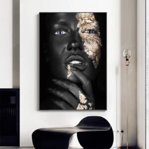 A monochromatic NOIR GOLD WOMAN portrait of a woman with textured gold accents on her face and hand, creating a contrast, displayed in a modern interior setting.