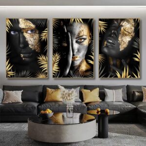 A triptych of artistic portraits featuring the NOIR GOLD WOMAN with gold leaf accents displayed above a modern living room sofa.