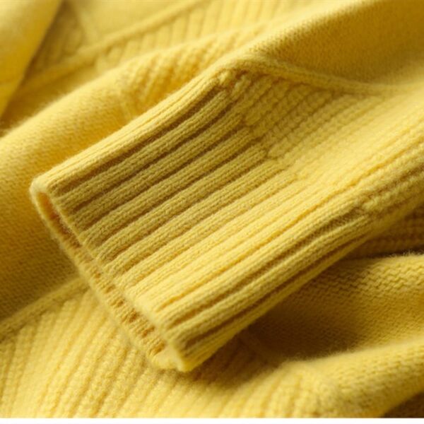 Close-up of the texture and ribbed cuff of a LOOSE CASHMERE SWEATER.