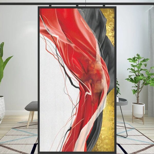 Sentence with Product Name: Golding abstract red and black art piece with golding accents displayed on an easel in a modern interior setting.