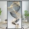 A modern GOLDING ABSTRACT artwork displaying swirling patterns on a canvas, positioned within a stylish interior room setting.