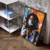 Colorful portrait of BOB MARLEY ROOTS with headphones resting against an interior wall, near a modern shelf with books.