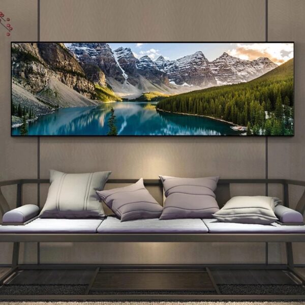 A couch with several pillows sits below a large wall-mounted Landscape Wall Art.