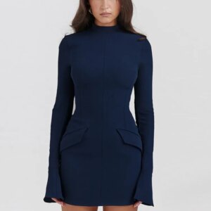 A woman in an Elegant Solid High Waist Mini Dress, characterized by its navy blue color, long sleeves, and high neck, standing against a plain white background.